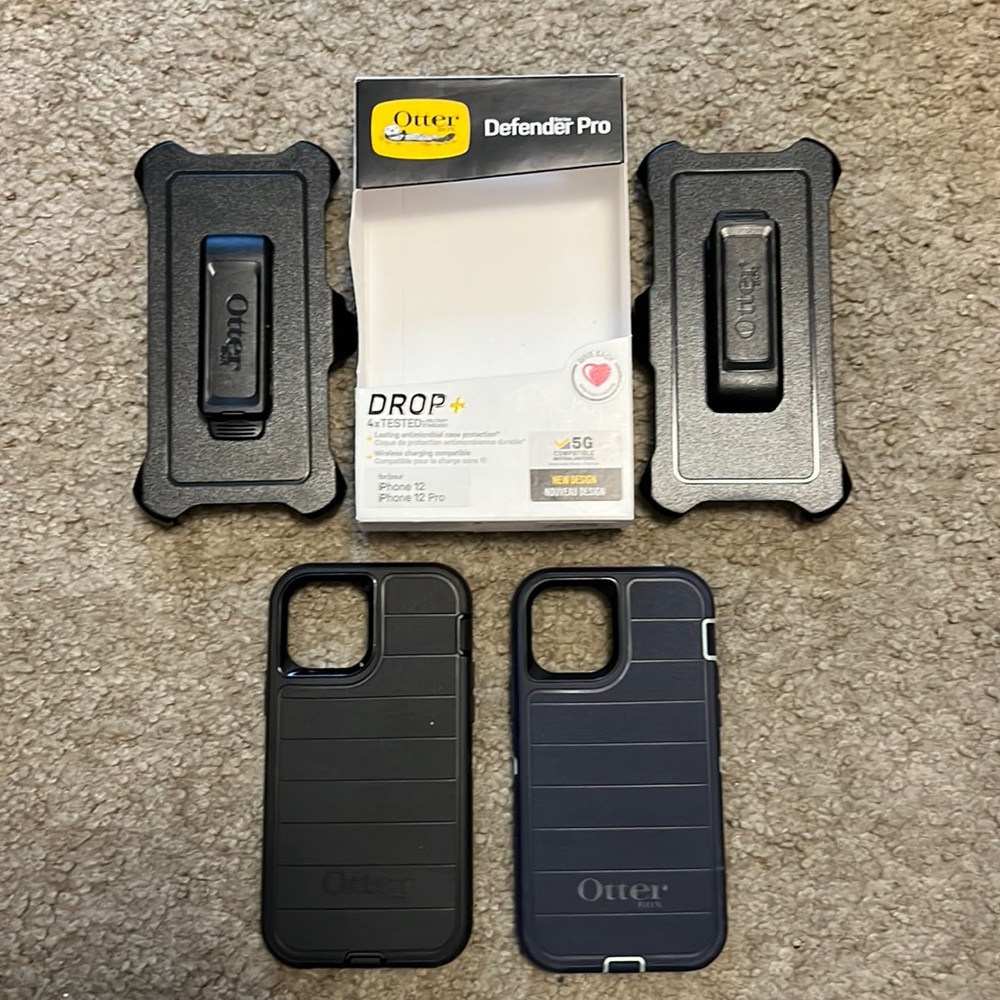 Two iPhone 12s phone cases with phone clip holders all brand new never used